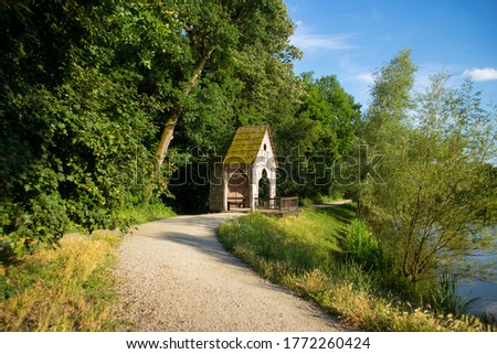 Beautiful white birch cottage on the shore of Maksimir lake in dense, green forest of the biggest and oldest park of the Zagreb city, Croatia