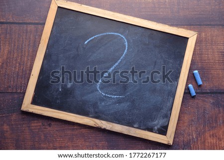 high angle view of question mark on chalkboard 