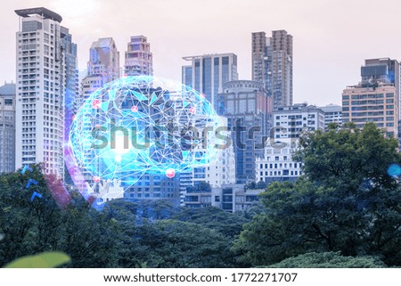 Brain hologram over panorama city view of Bangkok, the largest science hub in Asia. The concept of developing coding and high-tech science. Double exposure.