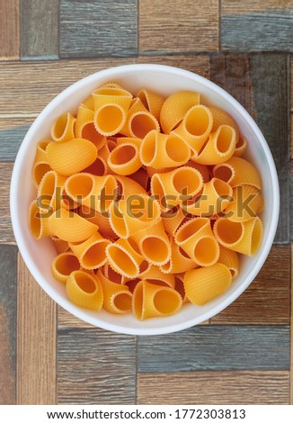 Macaroni in a bowl ready for cooking