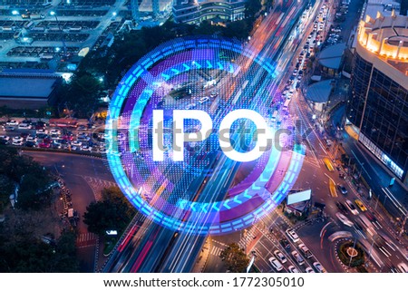 IPO icon hologram on aerial view of road, busy urban traffic highway at night. Junction network of transportation infrastructure. The concept of success in exceeding business opportunities. Royalty-Free Stock Photo #1772305010