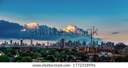 Skyline of Downtown Toronto at dusk from a rooftop in Little Portugal