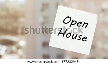 white paper with text Open House on the window