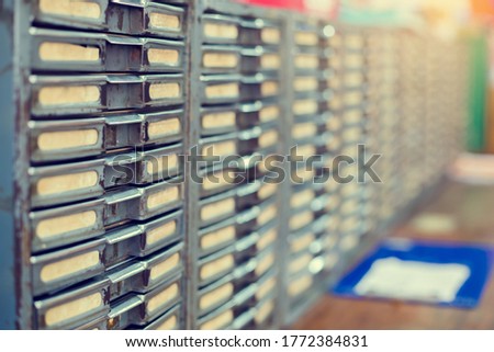 Old metal file cabinet. Manual control product system in old warehouse. The concept of old database system.