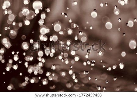 Blurred images and bokeh made with warm white water droplets