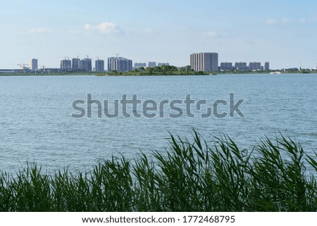 The city on the opposite side of the lake. Photo in Suzhou, China.
