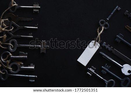 Set of vintage keys for lock. Retro keys on a dark stone background. The concept of choosing the path to achieve the goal.