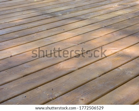 Flooring made from wood stained wood decking
