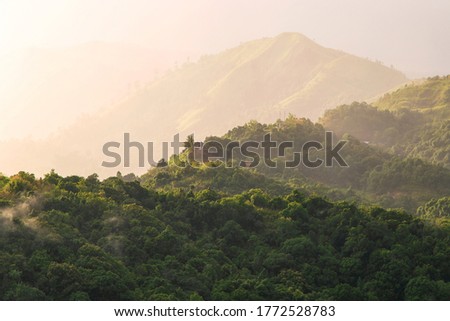 Beautiful of nature, Scenic view of mountain with sun rays after the rain in sunset