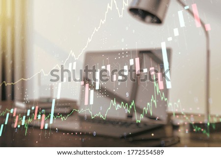 Abstract creative financial graph on modern laptop background, forex and investment concept. Multiexposure