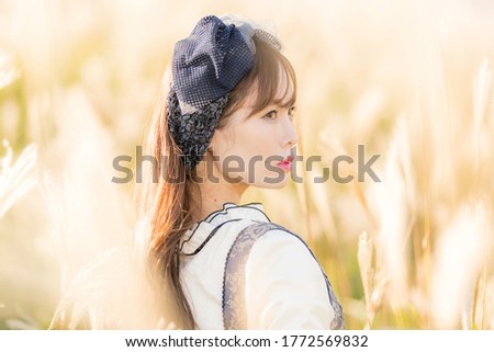Woman posing in front of pampas