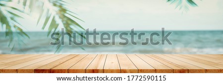 Panorama exterior clean floor wood board table top green coconut tree patio water beach wall background product panoramic display, Backdrop  sand tabletop surface perspective house tropical backyard.