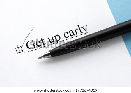 a piece of paper with the inscription get up early from to do list with a tick 