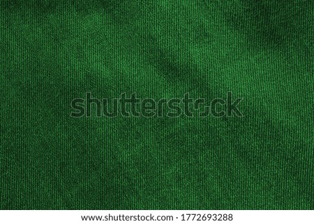 Green worn jeans cloth texture. Abstract background and texture for design. Jeans texture - Green cotton background