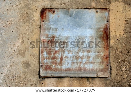 Rustic metal plate on cement for copy space