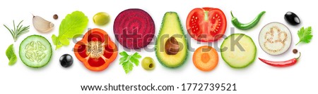 Isolated vegetable halves. Raw cut vegetables top view (beetroot, zucchini, carrot, avocado, bell pepper, cucumber, eggplant, tomato, spices and herbs) isolated on white background Royalty-Free Stock Photo #1772739521