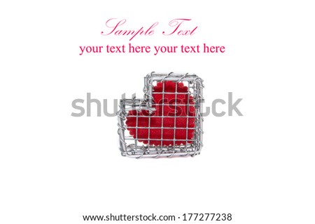 Heart in wire cage isolated on white background 