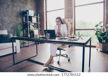 Portrait of her she pretty classy chic focused busy lady insurance specialist analyzing industry report anti crisis plan income growth at modern industrial loft brick interior workplace workstation