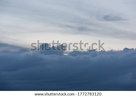 Horizontal landscape of beautiful blue dark clouds in the sky