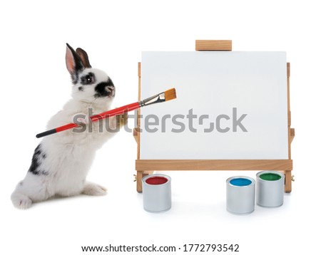  bunny stand at the easel with tassels isolated on a white background. for writing your text