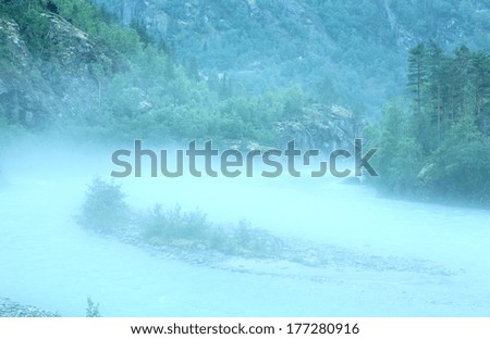 Dense fog over a mountain stream (Norway).