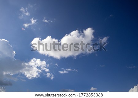 A blue sky with clouds background image