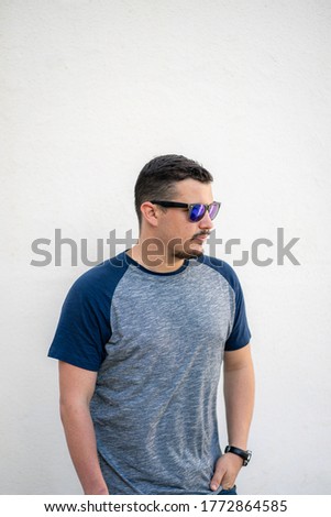 Man with blue singlasses in white background