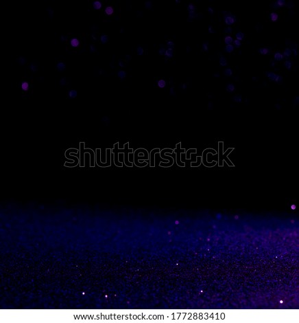 purple Sparkling Lights Festive background with texture. Abstract Christmas twinkled bright bokeh defocused and Falling stars. Winter Card or invitation.