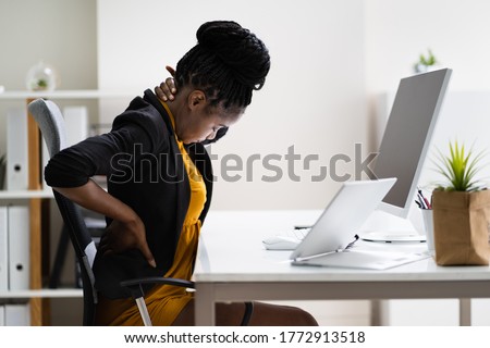 Back Pain Bad Posture Woman Sitting In Office Royalty-Free Stock Photo #1772913518