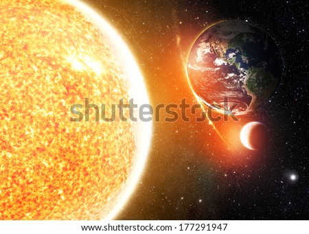 The Earth, Sun and Moon - Elements of this image furnished by NASA