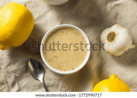 Homemade Lemon Garlic Vinaigrette Dressing with Salt and Pepper Royalty-Free Stock Photo #1772990717