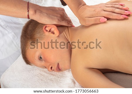 the nurse gives the child a baby massage