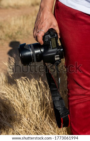 Photographer holding a camera in his hand