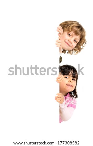 Children posing with a white board isolated in white