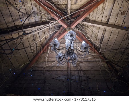 chandelier and lighting in a wooden arbor