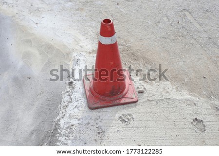 red and yellow traffic cones