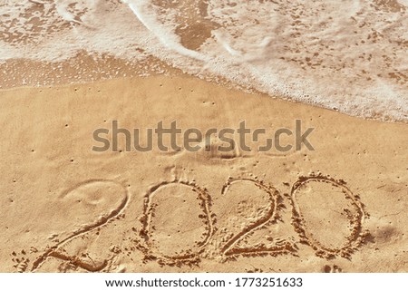 2020 year sand island exotic tropics ocean waves foam             