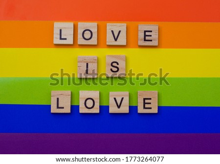 LGBT pride. Lesbian Gay Bisexual Transgender. LGBT, love is love letters on the LGBT flag. The concept of rainbow love. Human rights and tolerance. Poster, postcard, banner and background.
