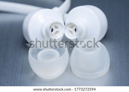 close shot images of an old or used wired earphone plug.