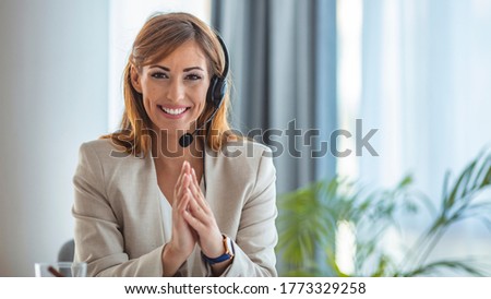 Portrait of female worker customer service. Shot of a young woman using a headset and laptop in a modern office. Portrait of a call centre agent working in an office 