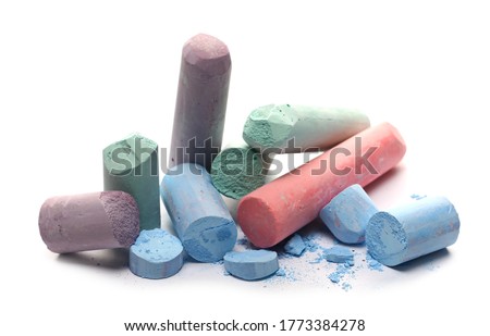 Colorful broken, used chalks isolated on white background