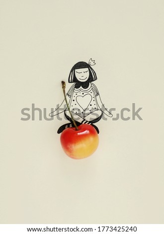 An illustration drawing of a girl sitting on real cherry fruit