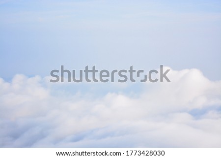 Sea of clouds from the top of the mountain and clear sky. Selective Focus