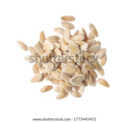 Pile of raw melon seeds on white background, top view. Vegetable planting