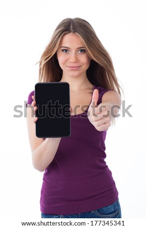 Cute woman showing an electronic tablet and having a positive gesture