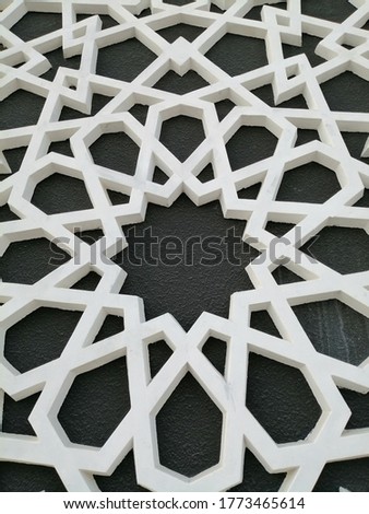Beautiful modern Arabesque pattern/design originating from ancient Islamic civilizations in the Middle East. The motif has linear interlacing line elements, resulting in repetitive geometric forms.