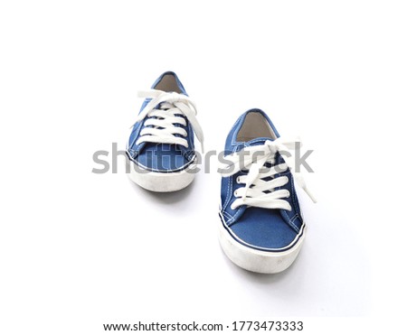 Pair of blue sneaker shoes on white background. 