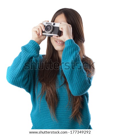 Young woman taking a photo on white background