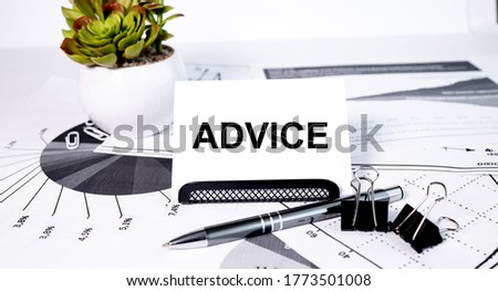 ADVICE - business concept text on WHITE STICKER with FINANCIAL GRAPHIC and HANDLE