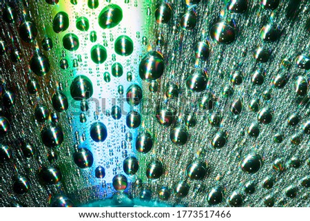 Macro of water drops on multicolor background